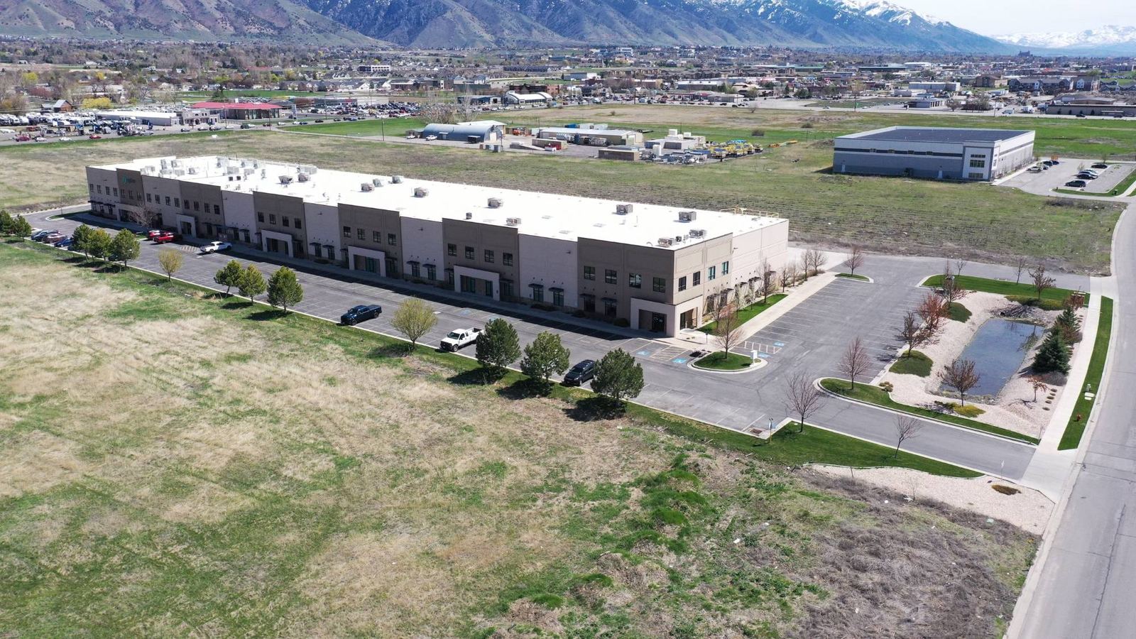 Aerial view of a long two-story multi-tenant flex building